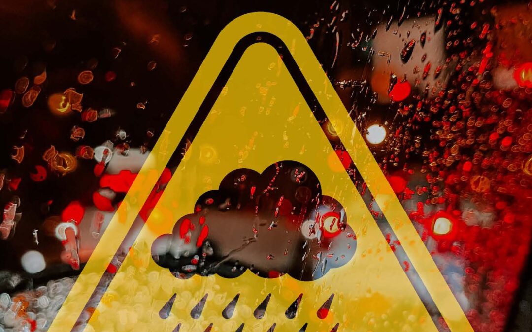 Yellow warning triangle with weather hazard symbols including rain, hail, and storm clouds - forensic meteorology expert witness evidence for legal cases involving slip and fall accidents, premises liability, and insurance claims across United States